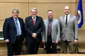 Sen. Bill Weber poses with representatives from truShrimp following a committee hearing in February, 2017