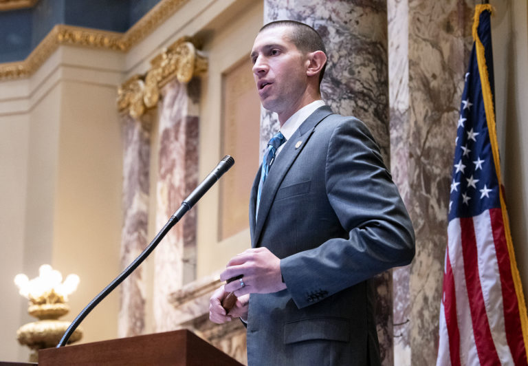 Senator Jeremy Miller at the rostrum